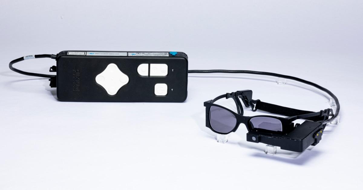 With a small eye implant and special glasses, some legally blind patients can re...